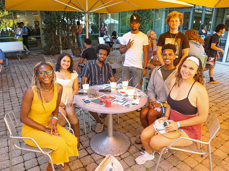 Tulane students gather around a table at commUNITY 2026.