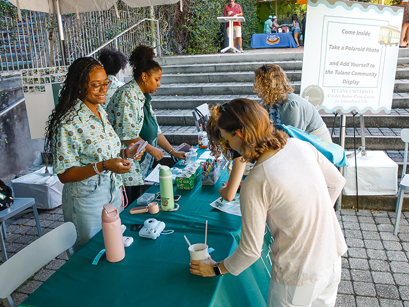 Tulanians gather around an informational table at commUNITY 2026.