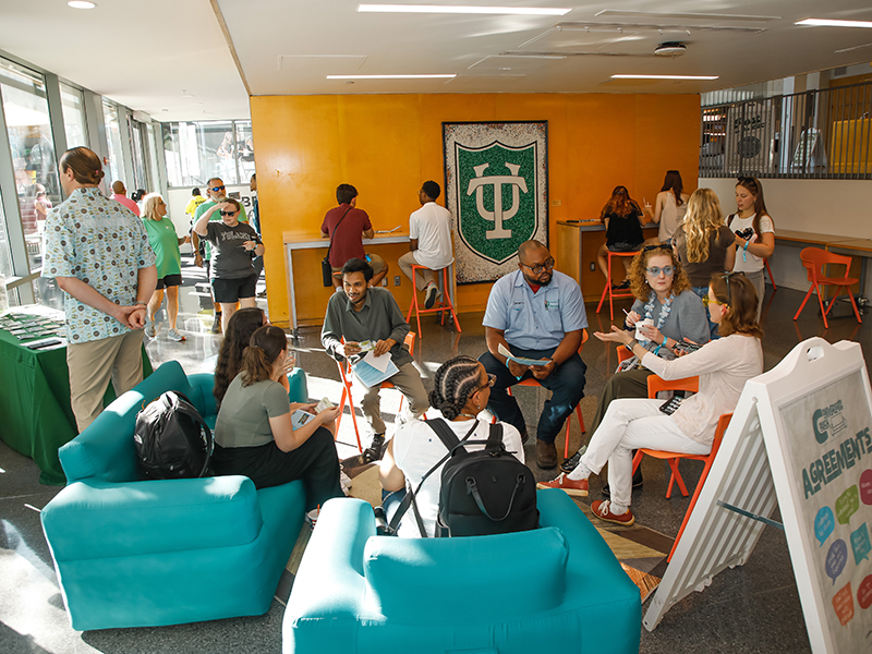Tulanians sit in a circle for a group discussion at commUNITY 2026.