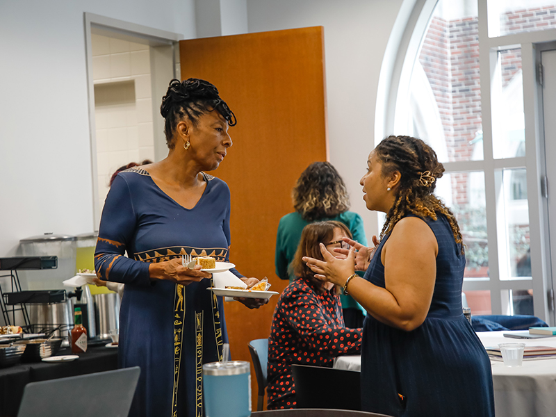 Carolyn Barber-Pierre talks with a Tulanian after a Booked! workshop.
