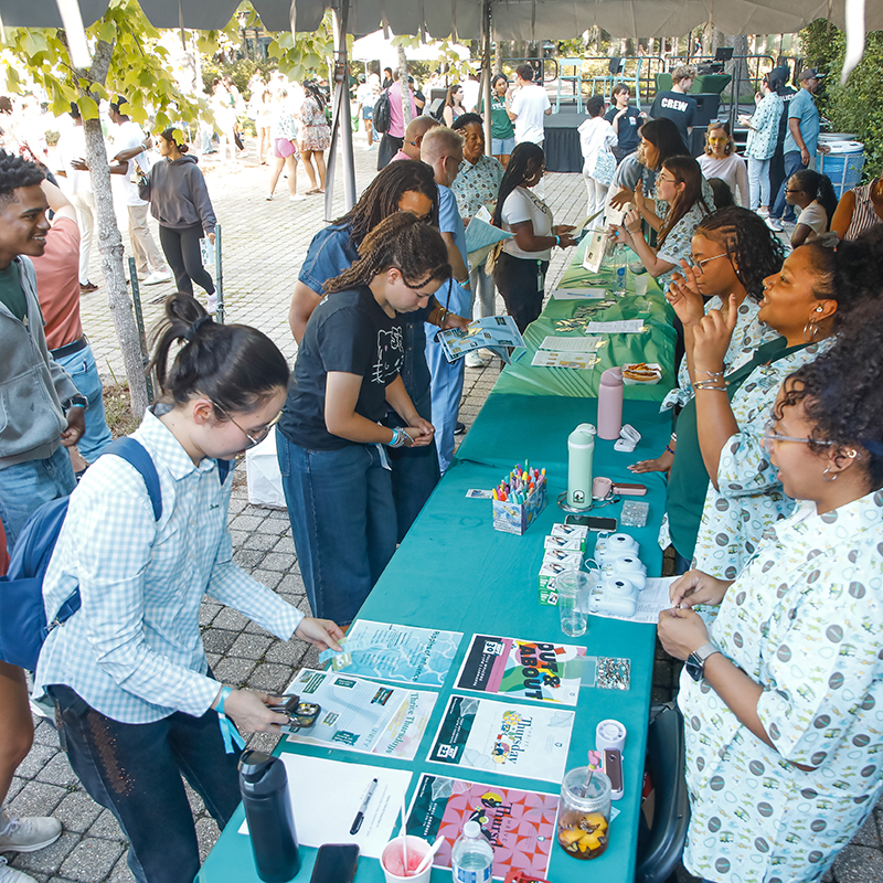 Tulane students gather around informational tables, looking to get involved.