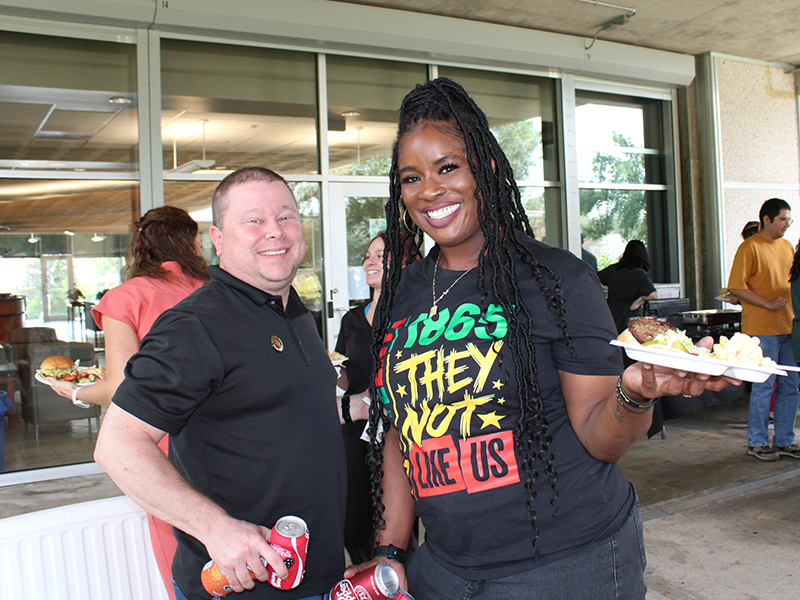 Two Tulanians enjoy Juneteenth at the Tulane National Biomedical Research Center.