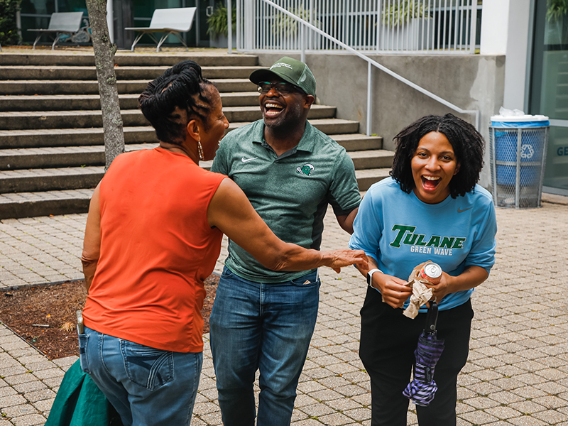 Three Tulanians laugh together during Juneteenth on Tulane's Uptown campus.