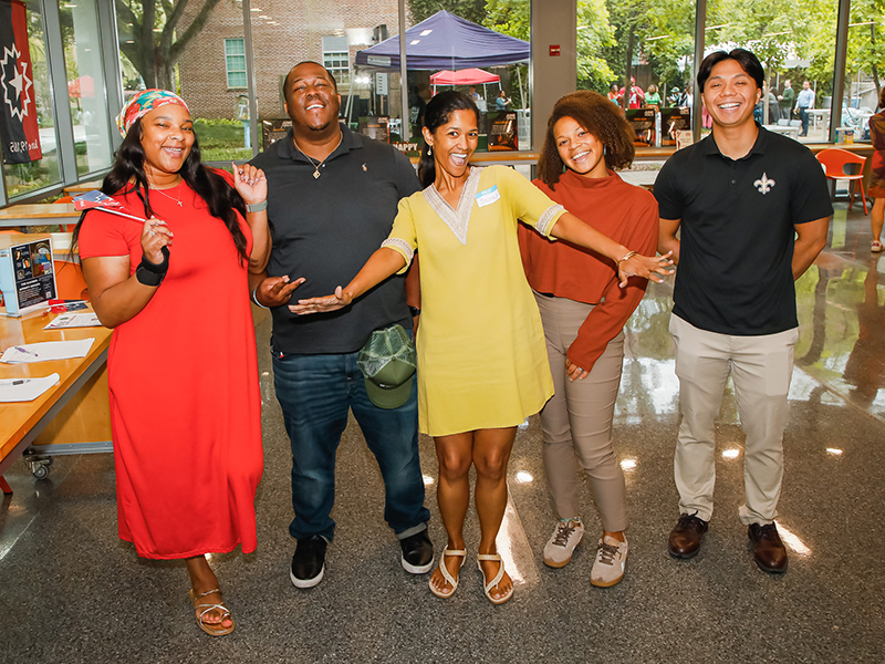 A group of Tulane staff pose for the camera during Juneteenth on Tulane's Uptown campus.
