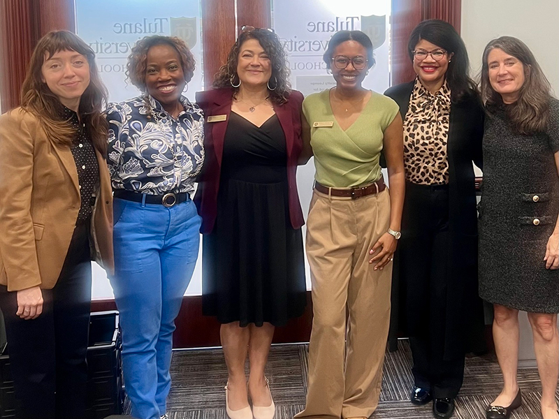 Tulane AEO staff and Tulane Law faculty stand together for a group photo.